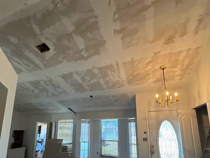 Drywall and ceiling mudding in progress by JM Home Industries