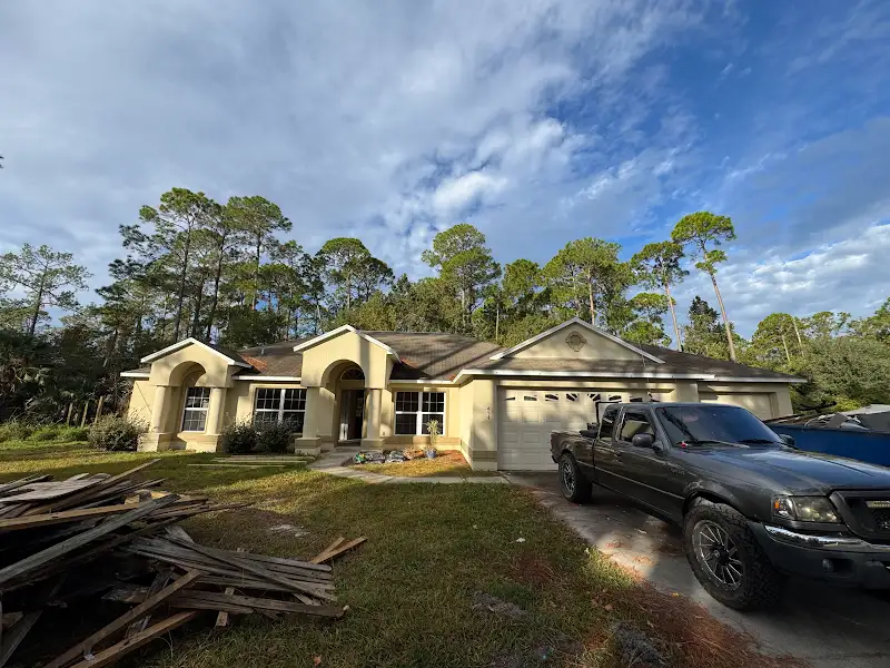 House exterior during renovation by JM Home Industries