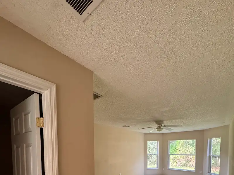 Room with textured ceiling by JM Home Industries