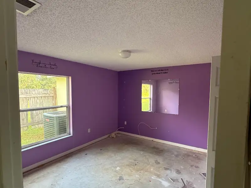 Purple bedroom before repaint by JM Home Industries