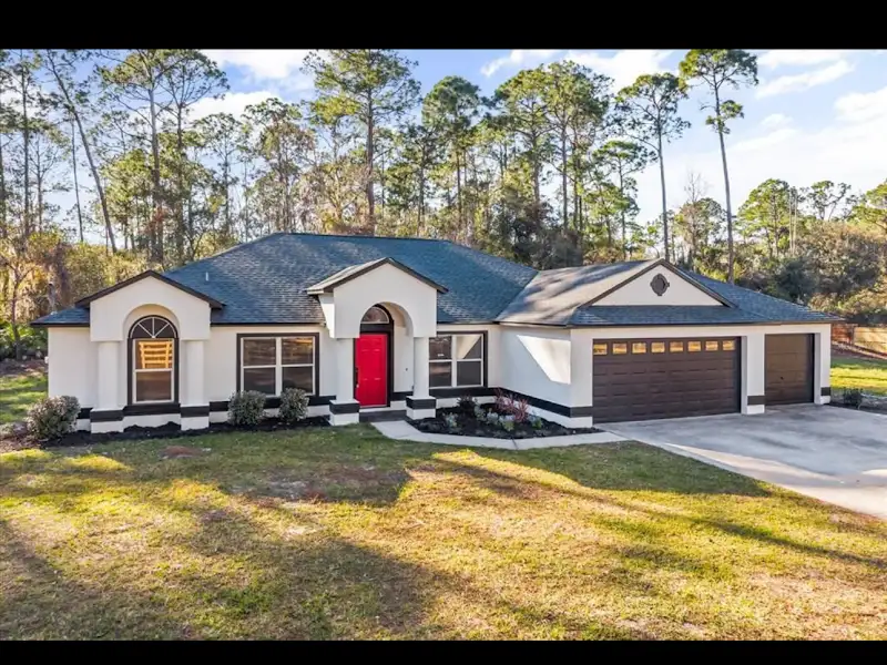 Beautiful stucco home exterior renovation by JM Home Industries