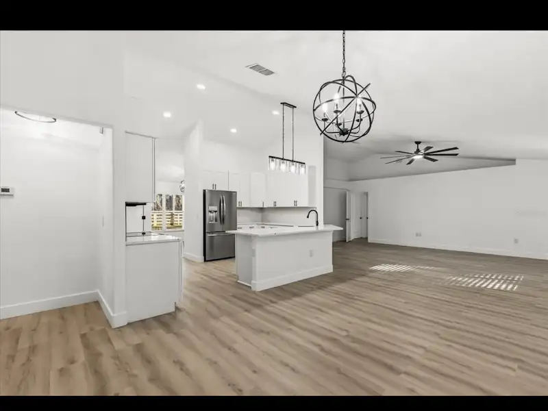 Open floor plan kitchen with island by JM Home Industries